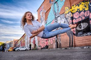 Levitation portrait in front of a graffiti wall